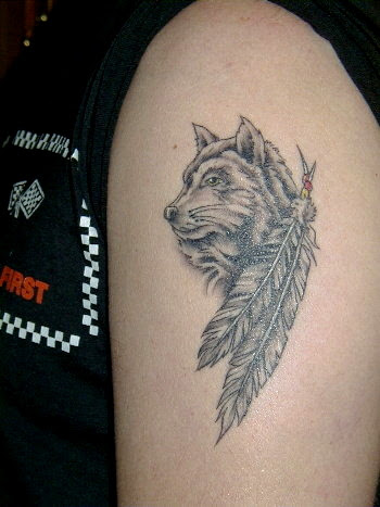 Design Of Wolf Tattoo On Arm And Lower Back Body Images