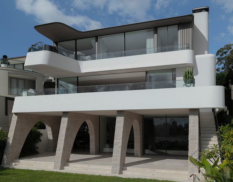 Sandstone Arches Provide Support For This Hillside House
