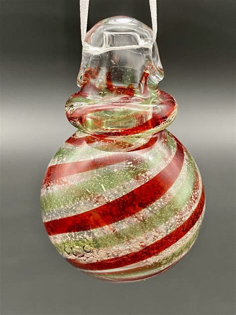 By wearing it or just holding it in your hand, you will connect with your loved one and . Christmas Ornaments | Davenport Memorial Glass | Blown