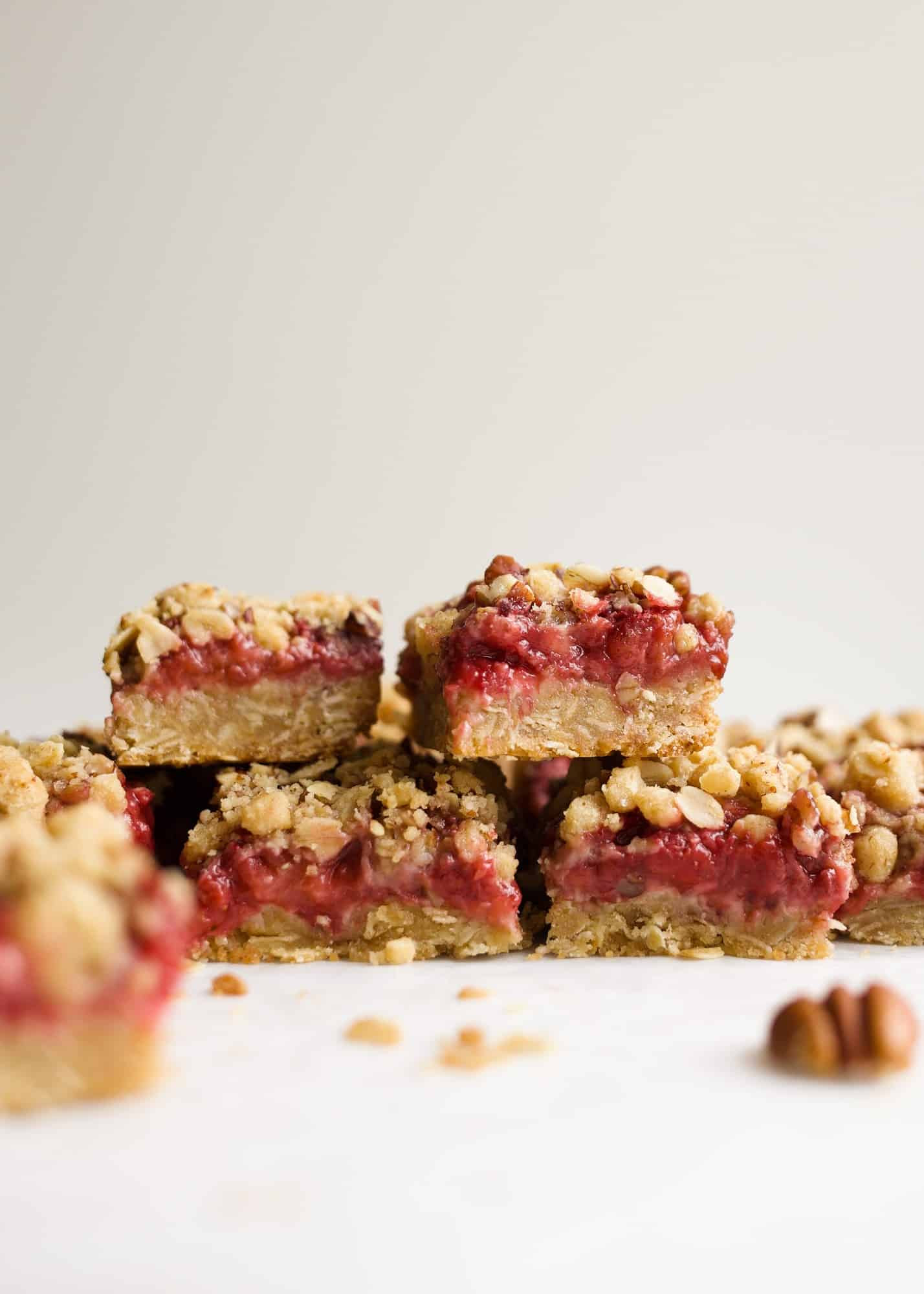 Strawberry Rhubarb Crumb Bars by Wood and Spoon blog are simple, make ahead jam filled bars made from spring fruit. The tart rhubarb makes a quick preserve with strawberries for a gooey centered oatmeal cookie bar. You can use fresh or frozen fruit for the jam and add additional fruit to make extra thick and fruity bars. Check out the recipe and how-to on thewoodandspoon.com