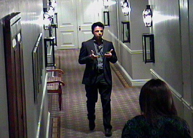 The CCTV footage was taken on the Friday, the day before she was shot. Dewani raises two fingers of each hand in what looks like an imitation of a handgun