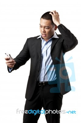 Confused Man Using Mobile Stock Photo Royalty Free Image Id 10097139