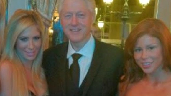 Bill Clinton with Tasha Reign (left) and Brooklyn Lee