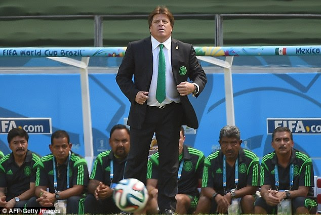 Warm? Herrera kept his jacket on during the clash with the Netherlands in the World Cup last 16