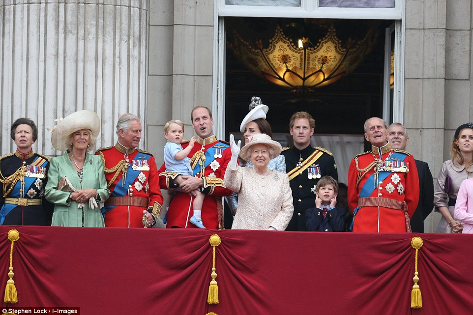 Queen Elizabeth waves from the balcony of Buckingham Palace during the Trooping of the Colour parade to mark her official birthday, alongside Prince George who delighted the adoring crowds waiting below