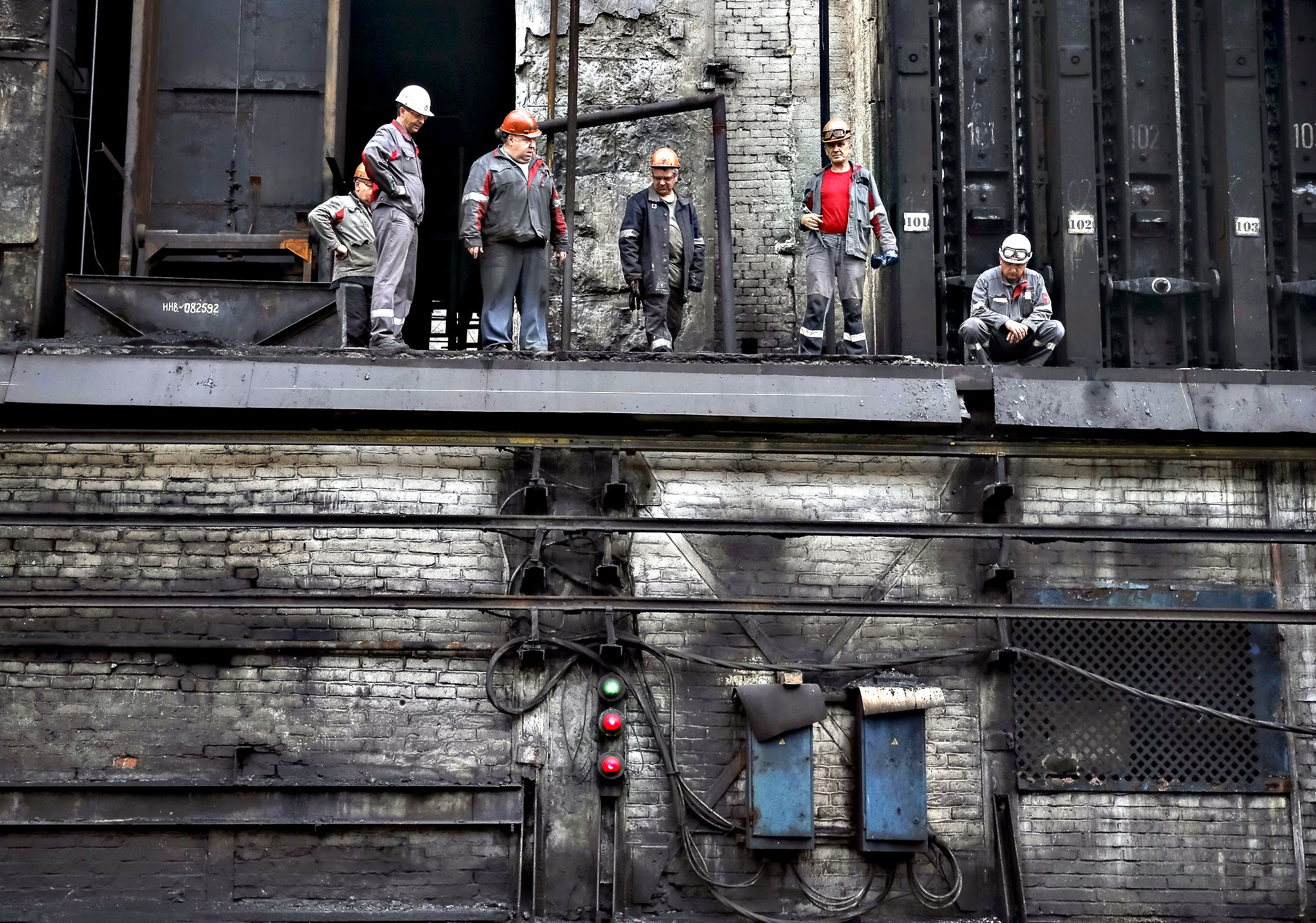 Workers are seen at a coke plant in the town of Avdiyivka near Donetsk, eastern Ukraine. Situated close to the 'contact line' between Ukrainian government forces and well-armed rebels, the Avdiyivka Coking Plant outside the rebel-held regional capital, Donetsk, has been hit by about 230 rocket and artillery attacks since hostilities erupted over a year ago. The Avdiyivka plant, owned by industrial tycoon Rinat Akhmetov's Metinvest group, is one of Europe's biggest coking plants and provides the fuel for the steelmaking industry, itself a vital branch of Ukraine's economy