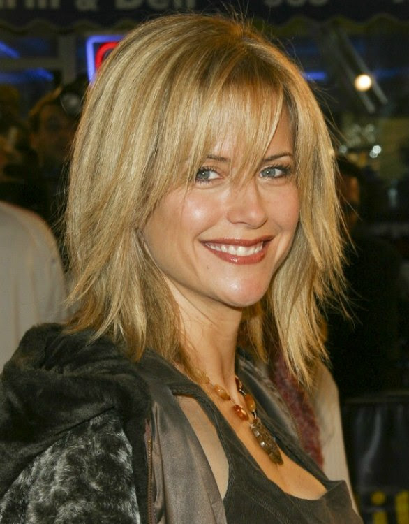 Kelly Preston's razor cut hairdo with textured ends