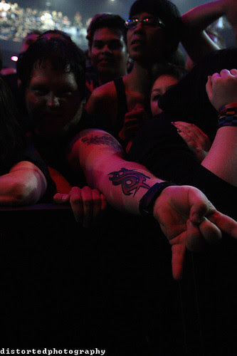 One of the band members that has a Nonagram tattoo is Chris Fehn (#3). slipknot tattoo