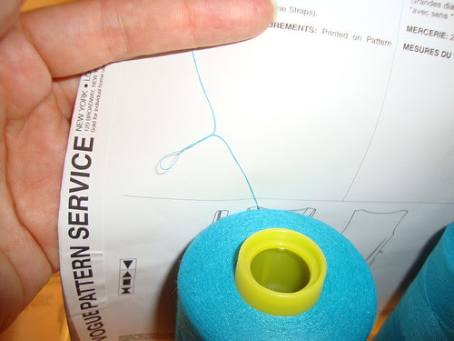 the serger thread coming off the spool and twisting up on itself