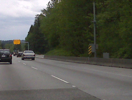 Glover Road Overheight detection system uses beams (of light) when interupted, flashing signals are triggered.