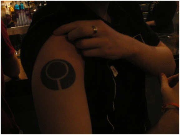Ross, a LJMU student, shows me his Marathon tattoo.