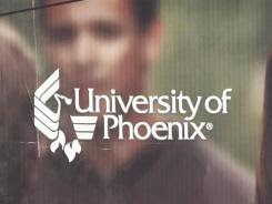 A University of Phoenix billboard is shown in Chandler, Ariz.