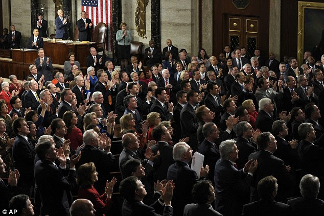 Tribute for a hero: Army Ranger Sgt. 1st Class Cory Remsburg is applauded after President Barack Obama acknowledged him during his State of the Union address on Capitol Hill