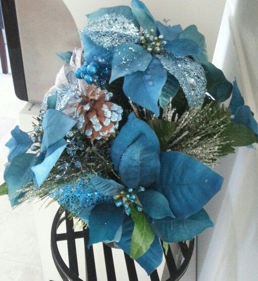 Glittery blue poinsettias centerpiece  Winter Wonderland Party  Pin 