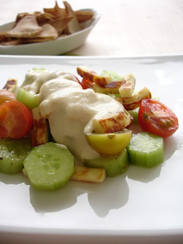 Cheese salad with hummus dressing and pitta crisps
