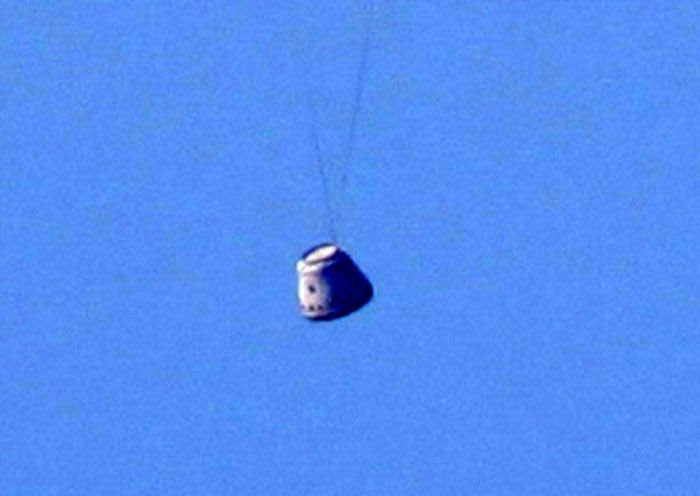 A close-up of the Dragon spacecraft just as it is about to splash down into the Pacific Ocean on December 8, 2010...following the completion of its maiden flight.
