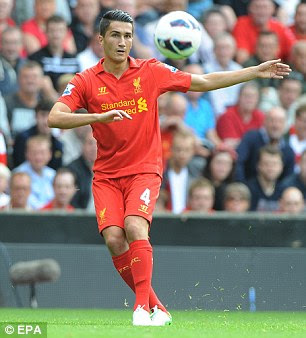On the ball: Sahin plays a pass at Anfield