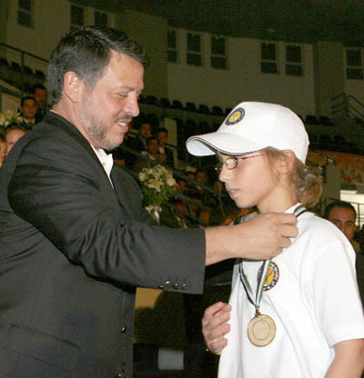 His Majesty King Abdullah presents HRH Princess Iman with a gold medal for His Majesty King Abdullah presents HRH Princess Iman with a gold medal for