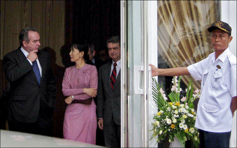 Detained Burmese opposition leader Aung San Suu Kyi talks with two senior American envoys