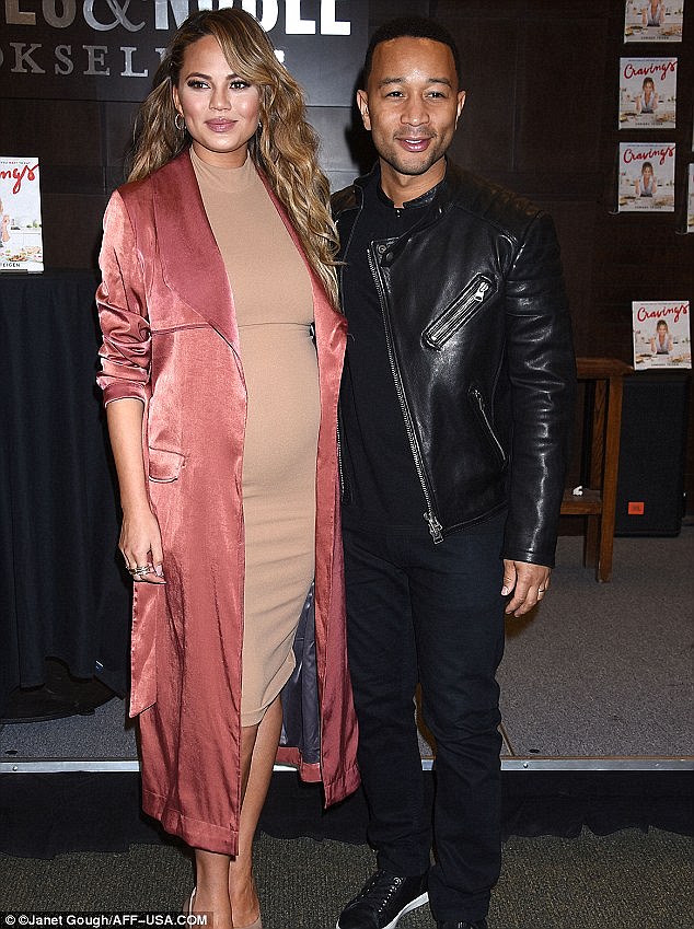 'I picked the girl from her little embryo': Chrissy Teigen, pictured with her husband John Legend in Los Angeles on Tuesday, revealed to People how involved she was in the process of selecting her future child 
