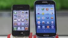 Samsung Electronics' Galaxy S III, right, and Apple's iPhone 4S are displayed at a mobile phone shop in Seoul, South Korea.