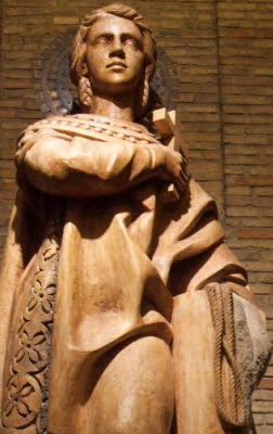 detail of a statue of Saint Encratia of Saragossa, date unknown, artist unknown; Crypt of the Church of Santa Engracia, Zaragoza, Spain; photographed on 4 October 2014 by Zarateman; swiped from Wikimedia Commons