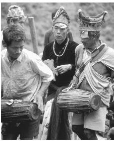 Nepalese men in a wedding ceremony; arranged marriages are the norm in mainstream culture.