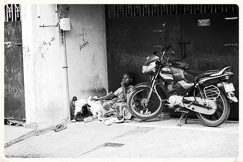 a second hand bike is more expensive than a poor woman by firoze shakir photographerno1
