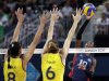 USA's Destinee Hooker (19, right) prepares to smash the ball past Brazil's Jaqueline Carvalho (8) and Thaisa Menezes (6) during a women's volleyball gold medal match at the 2012 Summer Olympics Saturday, Aug. 11, 2012, in London. (AP Photo/Chris O'Meara)