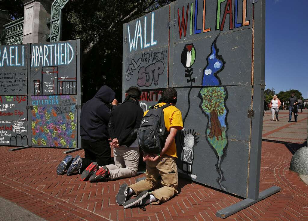 Protesters role-play detained Palestinians at the border during the mock demonstration to raise awareness about Israeli-Palestinian relations and protest Israel’s security policies. Photo: Leah Millis, The Chronicle