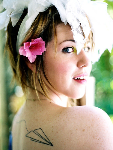 Paper Airplane Tattoo. Christy's got good taste in ink, no?