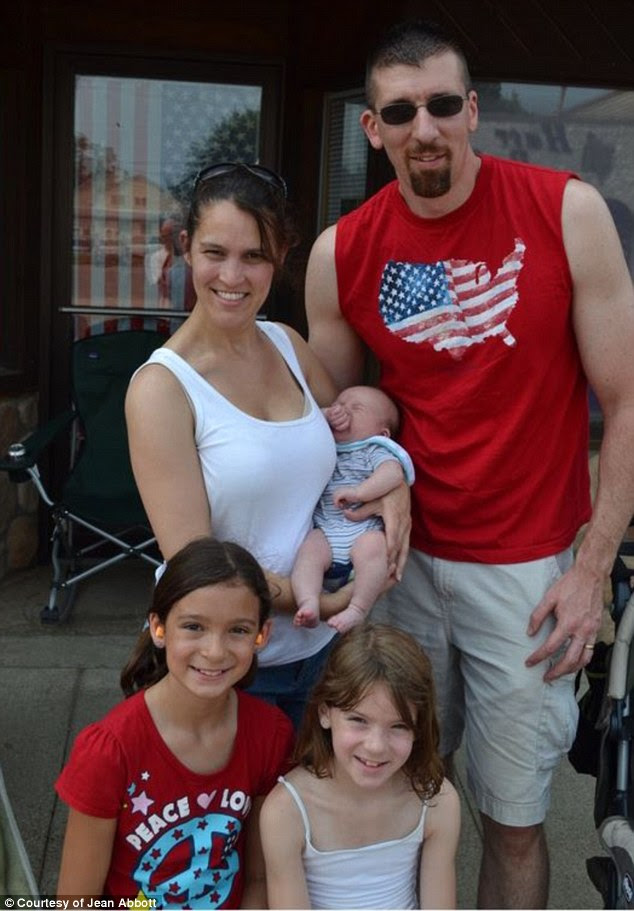 Happy family: Jean is pictured with her husband and their three children following her correct diagnosis of DRD
