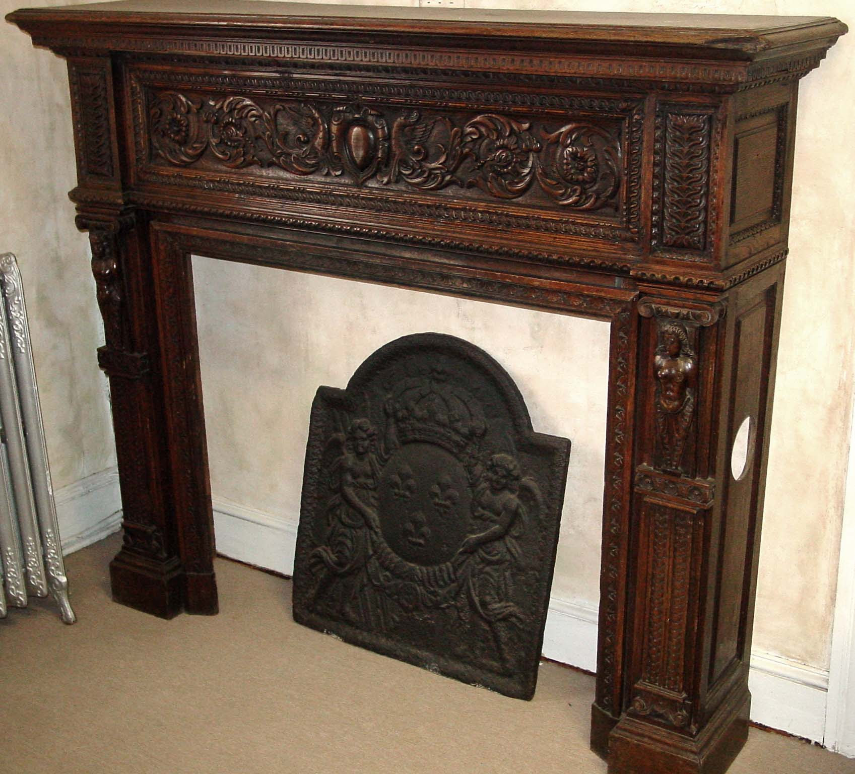 French, hand-carved wood fireplace mantel