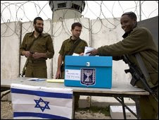 An Israeli soldier casts his vote in the Israeli general election on Monday, 9 February, 2009, in the West Bank 