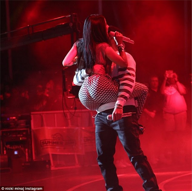 Woah there! Nicki leaped into Drake's arms during her performance, wrapping her legs around his hips as he gripped her waist with one arm