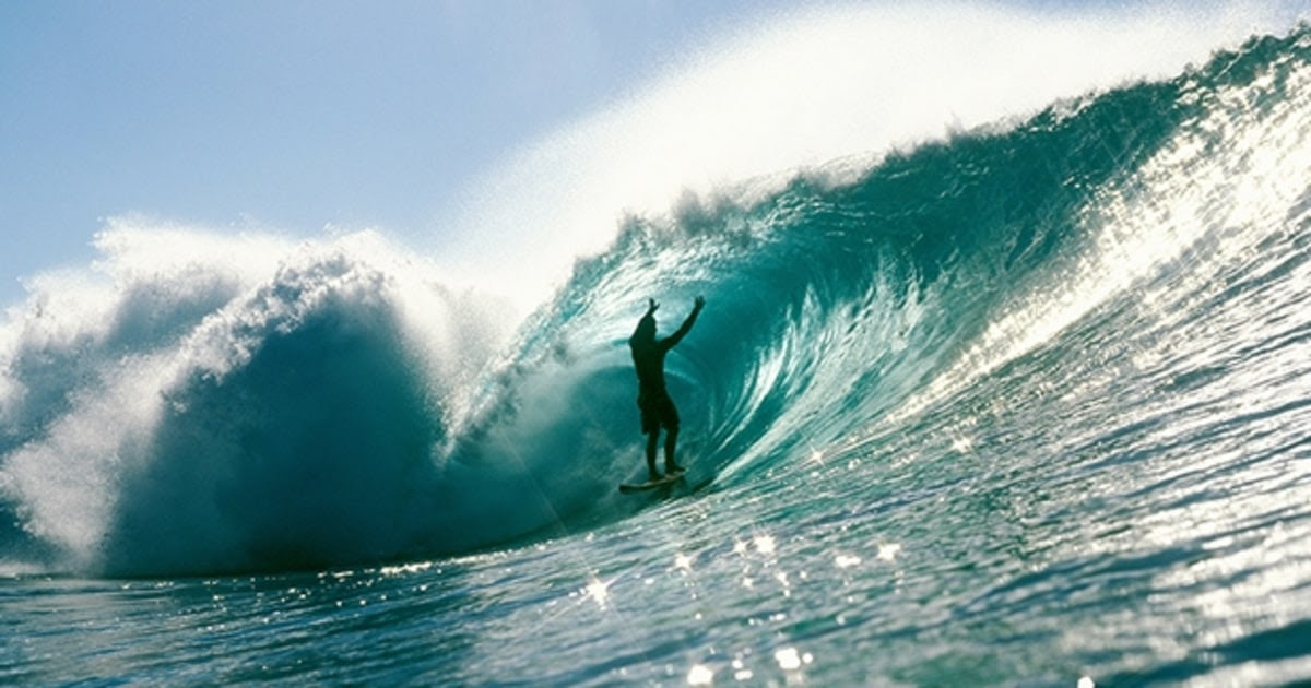 Surfers at Banzai Pipeline on the North Shore of Oahu