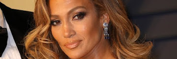 Jennifer Lopez shows off chiseled abs in pink bikini: ‘I’m a hustler
baby’