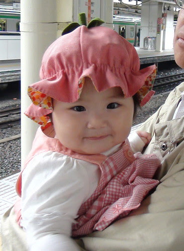 Miyu with a strawberry hat.