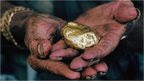 Hands holding gold