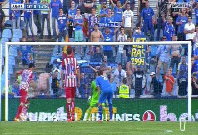Baring all: A Getafe fan shows his backside before Costa fluffed his penalty