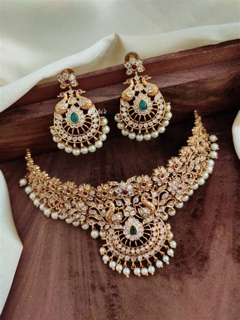 Here's a batch that can be yours for the taking (and layering!). AD Matte Flower Design Choker - South India Jewels
