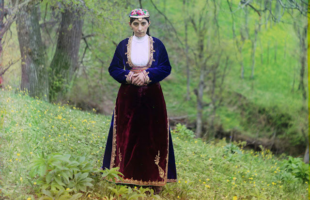 An Armenian woman in national costume poses for Prokudin-Gorskii on a hillside near Artvin (in present day Turkey), circa 1910.