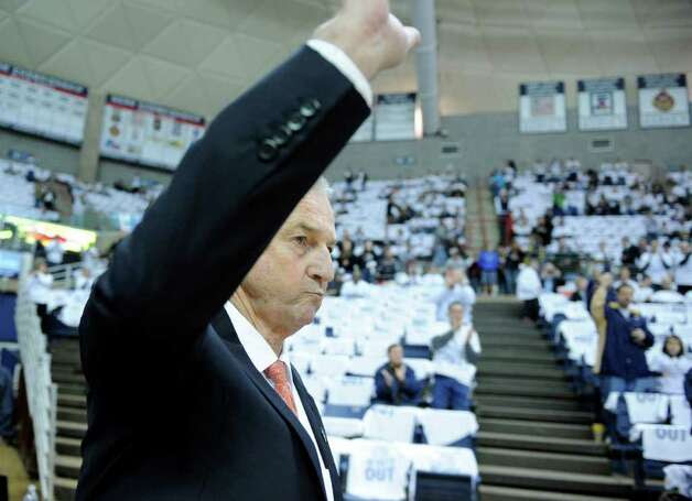 Connecticut coach Jim Calhoun acknowledges the crowd as he enters before his team's basketball game with Pittsburgh  in Storrs, Conn., on Saturday, March 3, 2012.  Calhoun missed the Huskies last eight games and had back surgery last Monday.(AP Photo/Fred Beckham) Photo: Fred Beckham, Associated Press / FR153656 AP