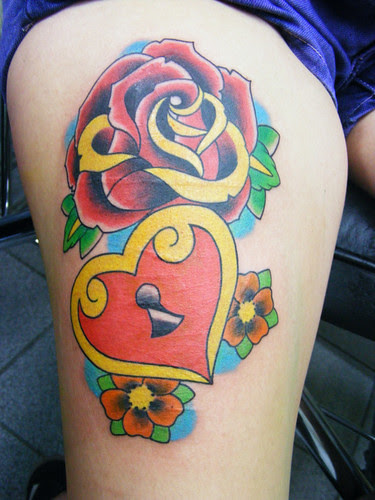 Rose Tattoo and Heart at Woman Body