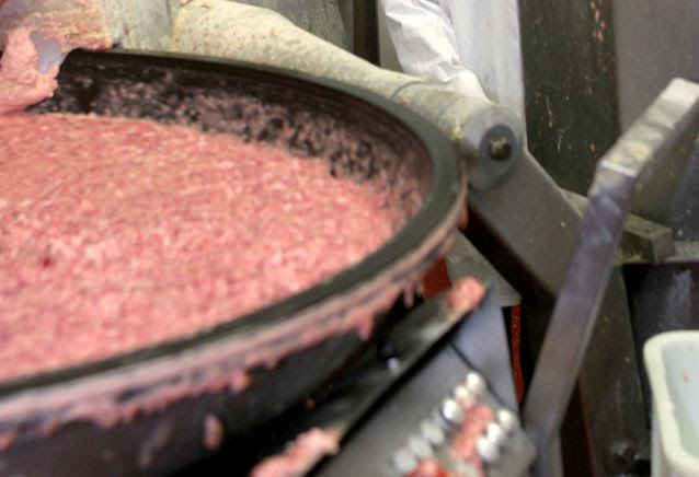 Appetising? In vast metal vats, tons of pork trimmings are mixed with the pink slurry formed when chicken carcasses are squeezed through metal grates and blasted with water