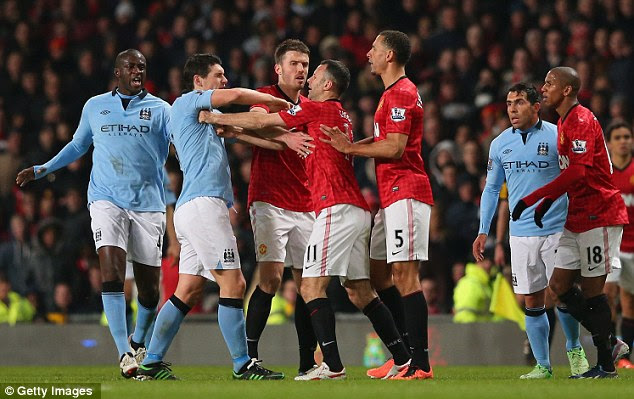 Getting shirty: Barry also had words with rival Ryan Giggs (centre) 