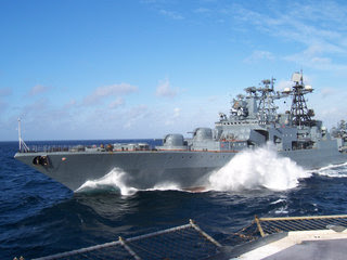 Russian warship escorts a 9-vessel convoy in the Gulf of Aden