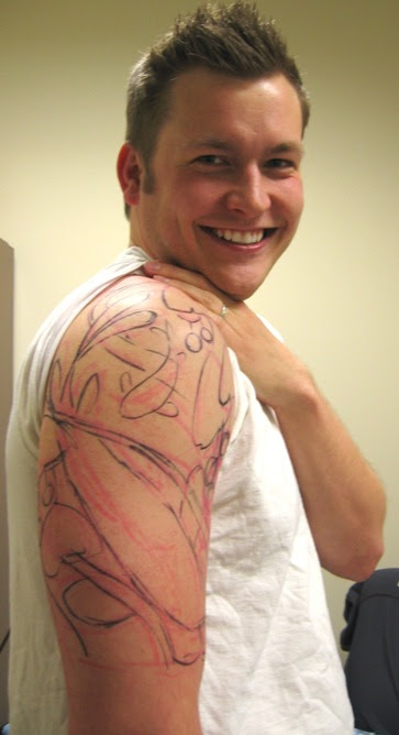 UPDATE2: Because kat suggested it, here's a picture of me with the tattoo 