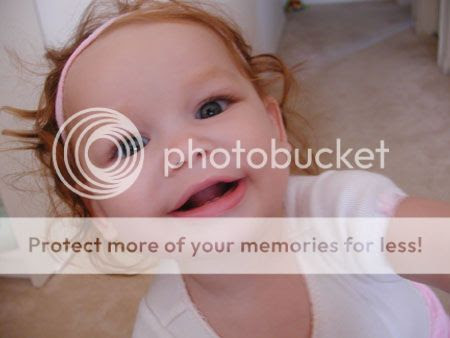 This is a biracial baby. Does she look it? How can you tell? That red hair?