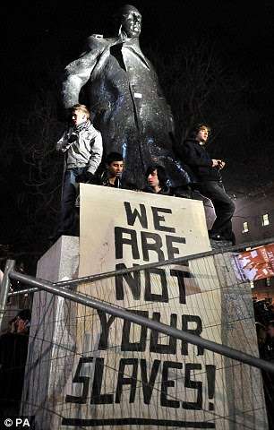 Message: A group of students make their feelings known at the statue of Churchill